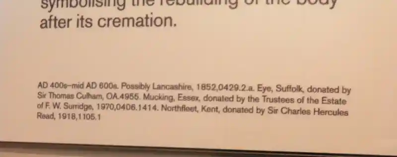 Metal cross with carved swastika at the center